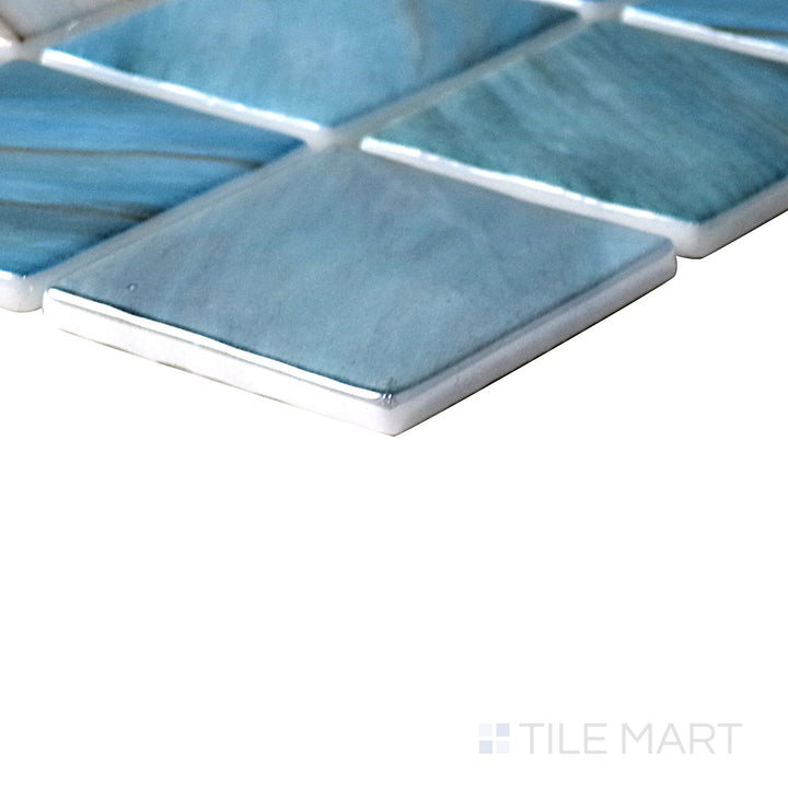 Angled shot of Onix Glass Zaira 2" square glossy mosaic, featuring a sleek modern design, reflective glossy finish, and structured square layout.  