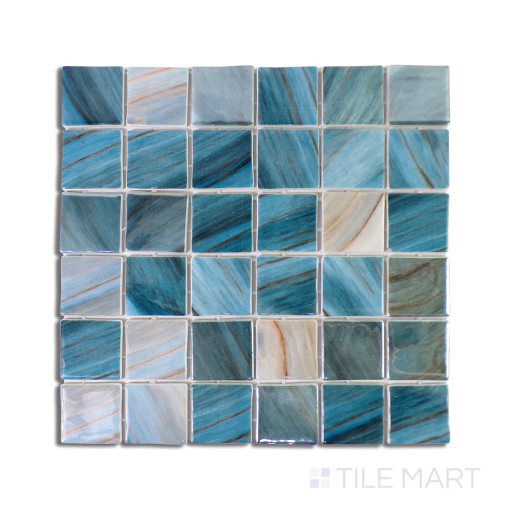Overhead shot of Onix Glass Zaira 2" Square Glossy Mosaic, a shimmering glass tile in a modern square format with reflective qualities for a sleek finish.