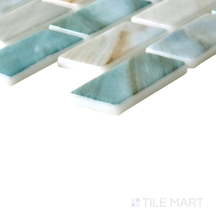 Angled shot of Onix Glass Zaira brick glossy mosaic, featuring a modern brick pattern, reflective glossy finish, and contemporary rectangular format.  