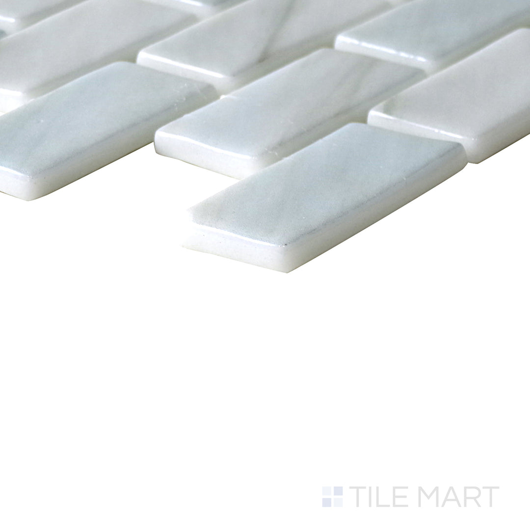 Diagonal view of Onix Glass Zhoe brick glossy mosaic, showcasing its sleek rectangular brick design, polished glossy surface, and uniform arrangement.  
