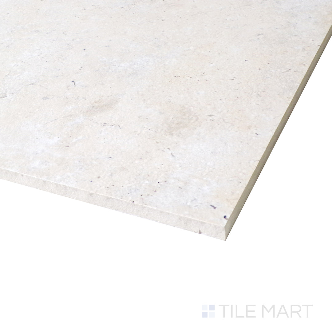 Diagonal view of Astrum Ivory 48x48 matte porcelain tile, showcasing its warm ivory tones, sleek matte surface, and large square layout.  