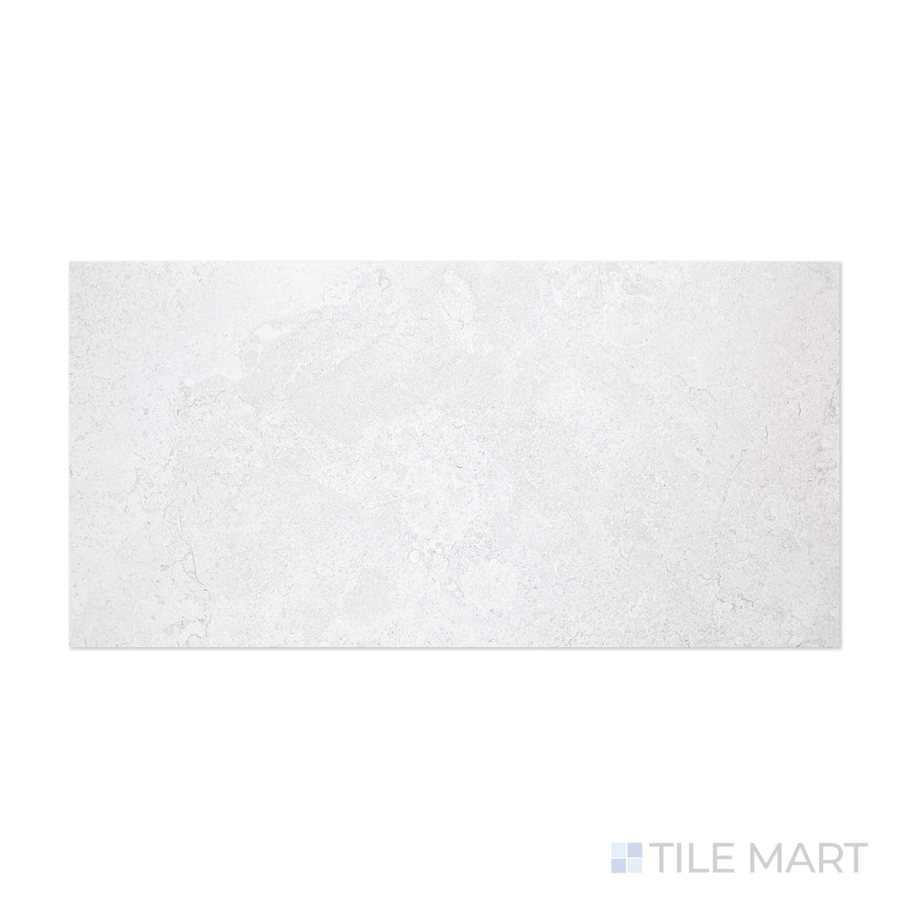 A refined blend of ivory and blue hues is showcased in this close-up of Epika Pedras Azul Ivory 24x48 matte porcelain tile, emphasizing its natural stone-inspired texture.