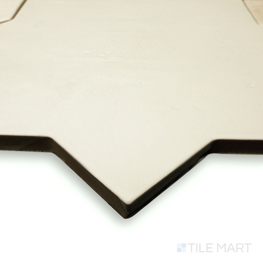 Corner shot of Amalfi Star Bone 7x7 matte porcelain tile, showcasing its light neutral shade, matte surface, and geometric star pattern.