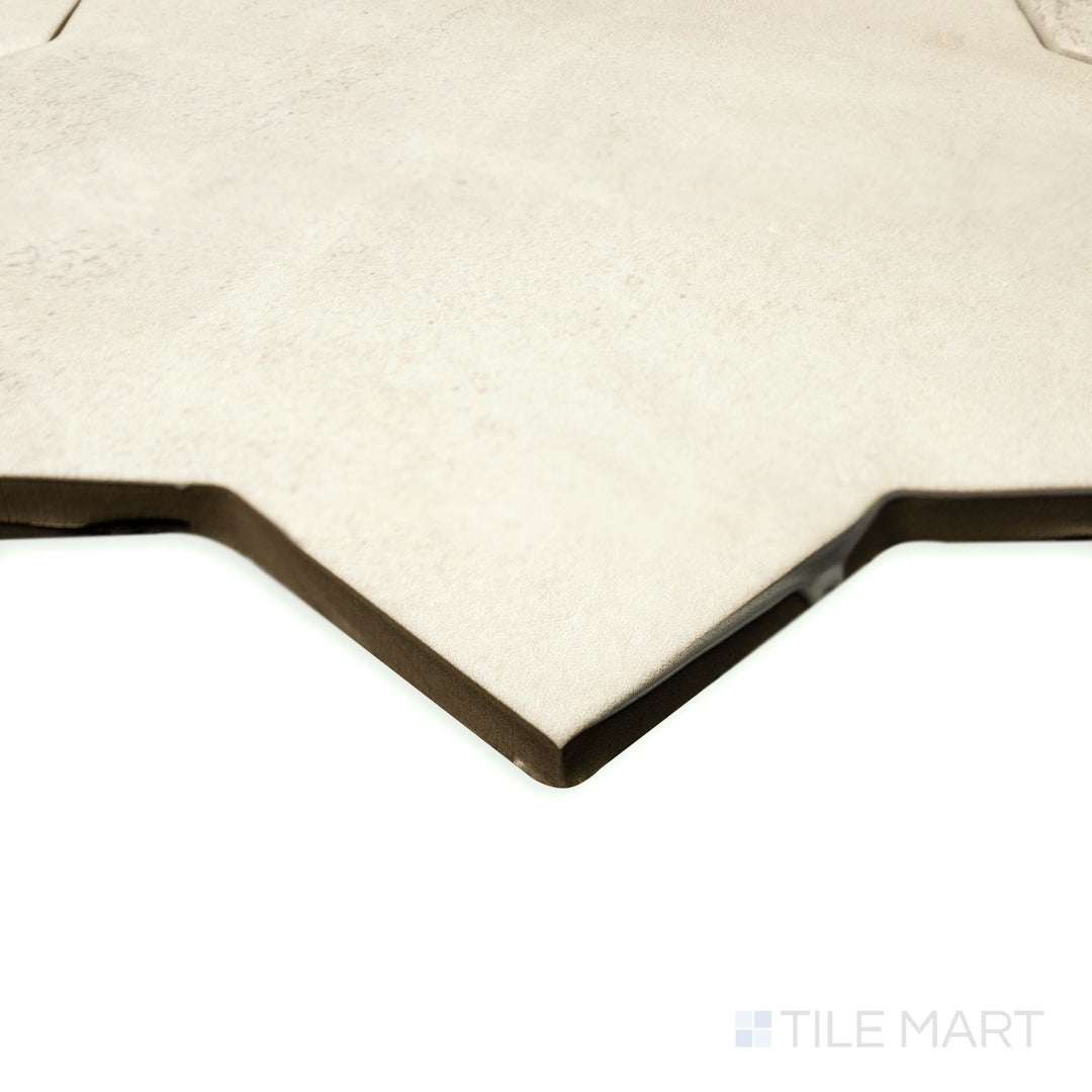 Angled view of Amalfi Star Gray 7x7 matte porcelain tile, focusing on the symmetrical star pattern, sharp corners, and smooth matte texture.