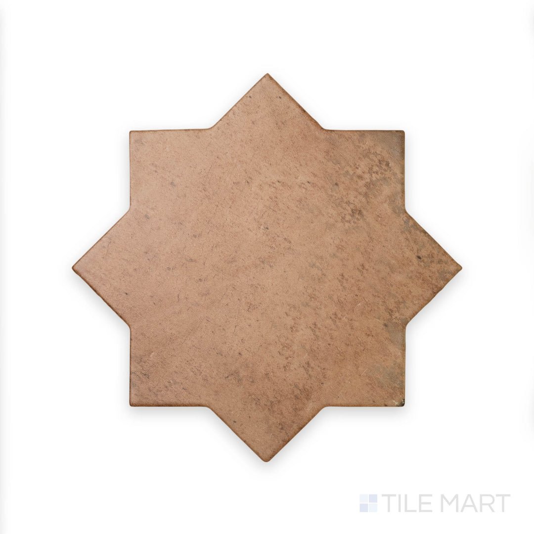 A terracotta hue with a timeless star pattern is captured in this close-up texture shot of Amalfi Star Terracota 7x7 matte porcelain tile, perfect for warm, rustic designs.