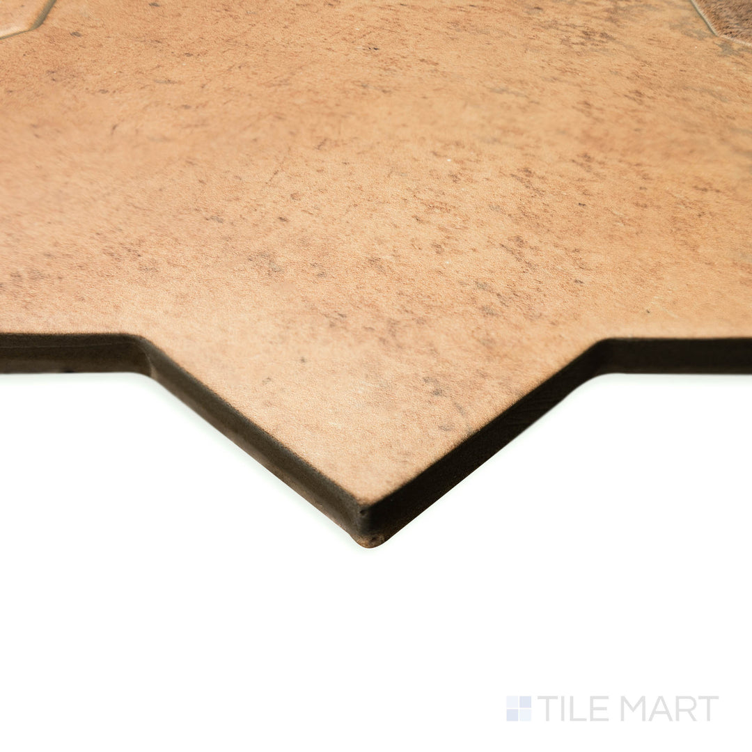 Corner perspective of Amalfi Star Terracotta 7x7 matte porcelain tile, capturing the warm terracotta hue, subtle texture, and geometric star detail.