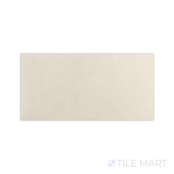 A clean matte white surface is magnified in this macro shot of Crush White 24x48 matte porcelain tile, emphasizing its uniform texture and sophisticated tone.