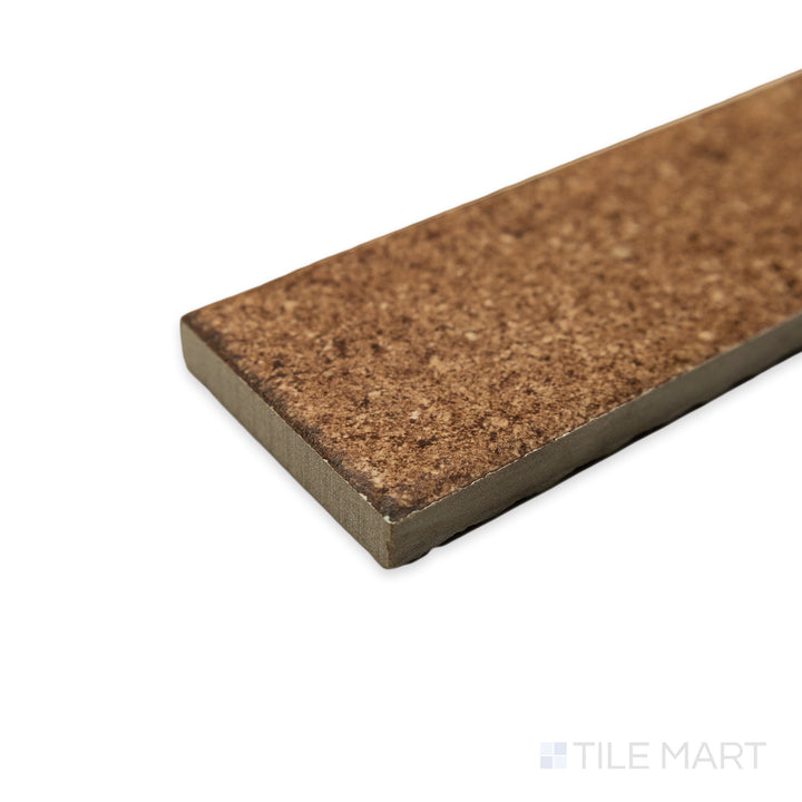 The Block Cotto 2x8 matte porcelain tile appears structured and refined in a corner shot, emphasizing its warm undertones and the way its edges create a precise intersection.