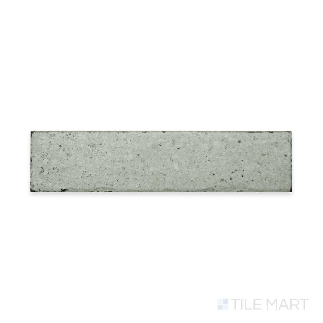 A neutral pearl shade with a fine matte texture is displayed in this close-up of Block Pearl 2x8 matte porcelain tile, offering a soft and versatile aesthetic.