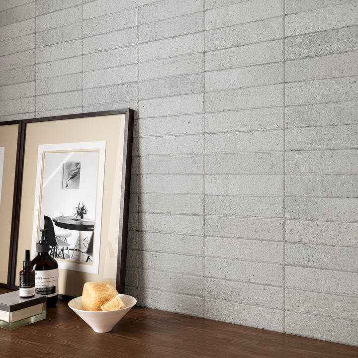 A refined and cozy interior showcasing Block Pearl 2X8 Matte Porcelain, where its soft, neutral shade brings a delicate balance of warmth and elegance.