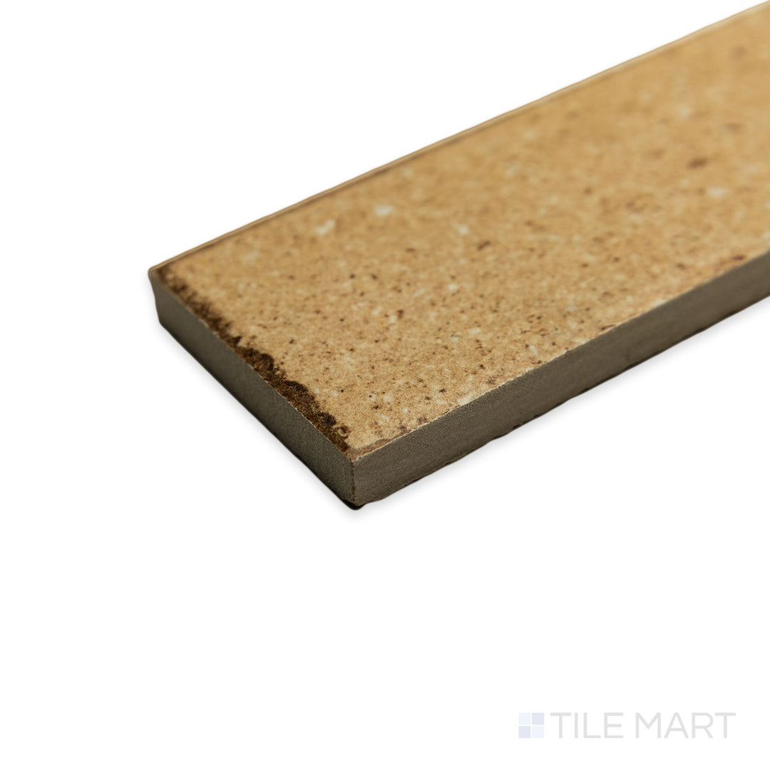 With a corner focus, the Block Sand 2x8 matte porcelain tile draws attention to its inviting beige shade, where edges align seamlessly for a refined, structured look.