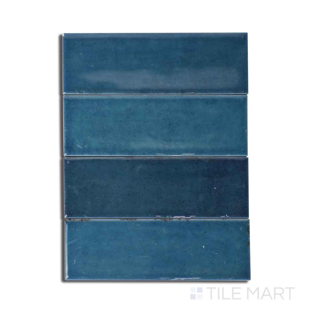 Top-down view of Calpe Blue 2X6 Glossy Porcelain, a deep blue porcelain tile with a high-gloss finish, adding a sleek and vibrant touch.