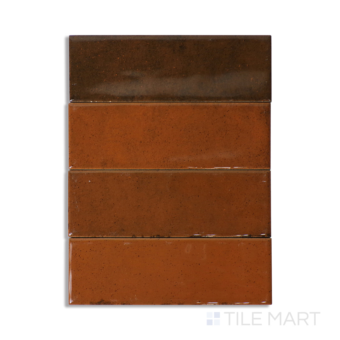 Overhead shot of Calpe Terra 2X6 Glossy Porcelain, a rich earthy-toned tile with a glossy finish, offering warmth and depth to any space.