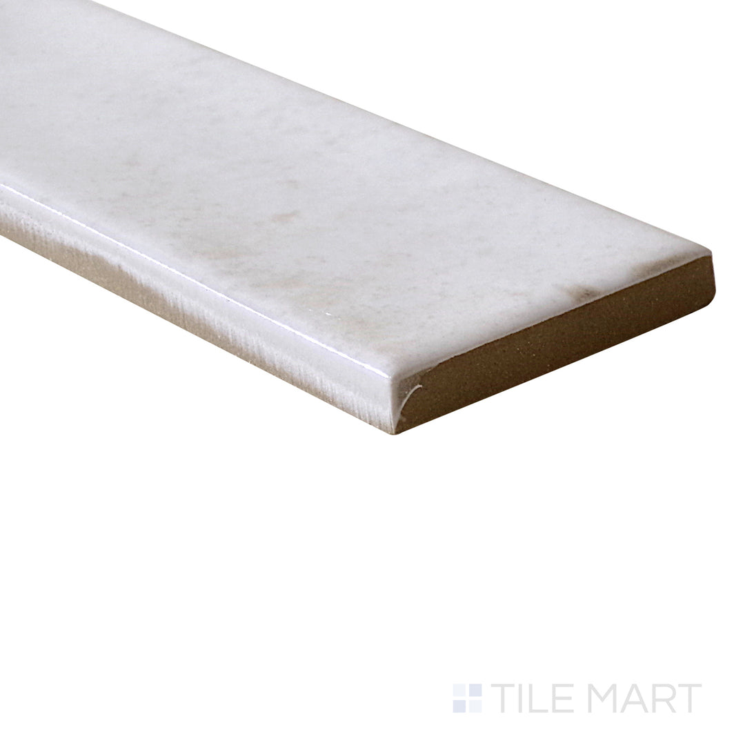 Angled shot of Calpe White 2x6 glossy porcelain tile, featuring a crisp white shade, smooth glossy texture, and a contemporary rectangular shape.  