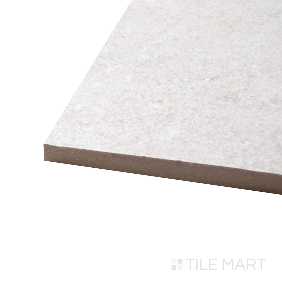 Side perspective of Dome Bone 24X48 Matte Porcelain Tile, capturing its neutral bone color with a subtle stone-like texture and a matte finish.