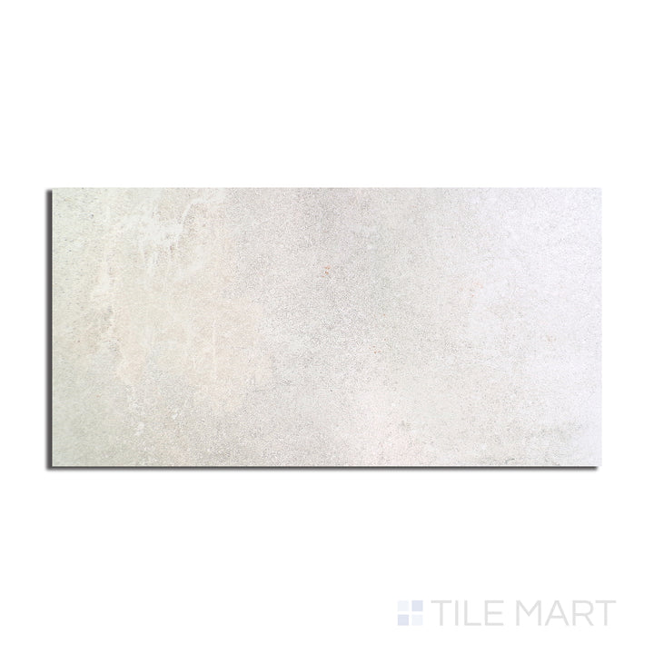Flat-lay of Dome Bone 24X48 Matte Porcelain, a large-format tile with a neutral bone shade and a matte finish, perfect for seamless elegance.