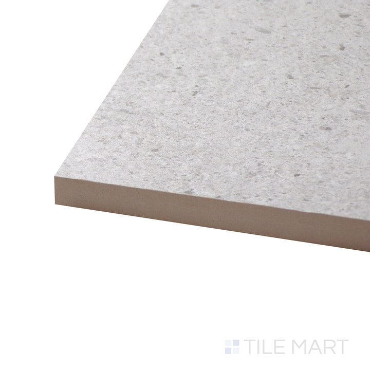 Corner angle of Dome Bone 12X36 Matte Porcelain Tile, emphasizing its neutral stone look with a soft, muted matte finish.