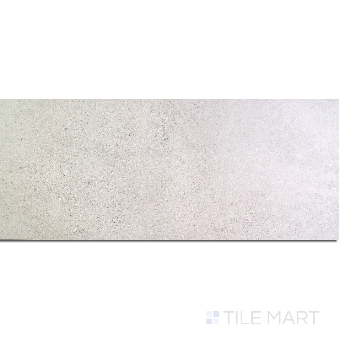 Flat-lay of Dome Bone 12X36 Matte Porcelain, a soft beige porcelain tile with a matte surface, offering understated sophistication.
