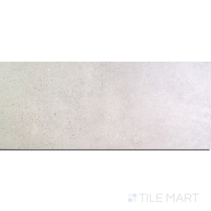 Flat-lay of Dome Bone 12X36 Matte Porcelain, a soft beige porcelain tile with a matte surface, offering understated sophistication.