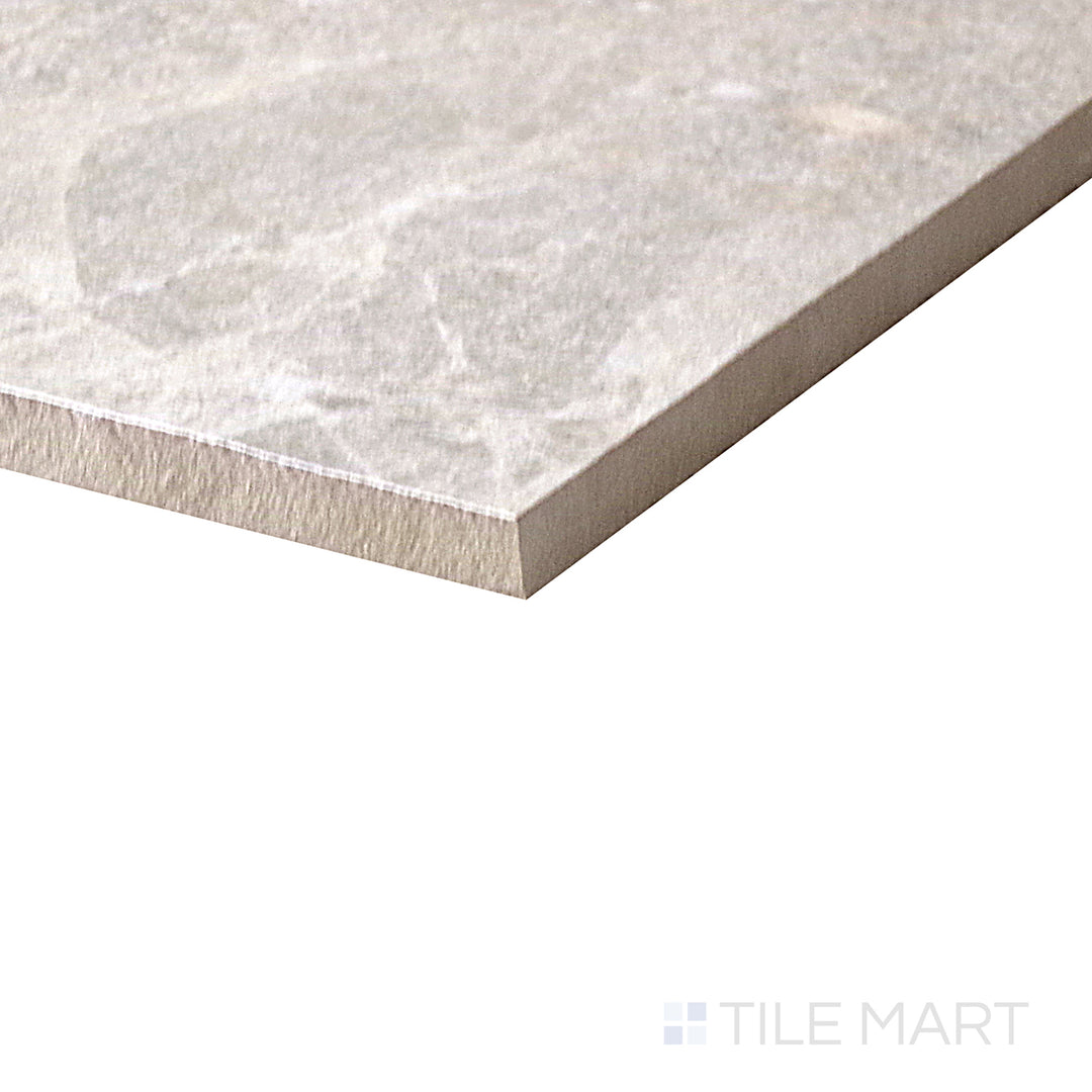 Angled shot of Dome Nut 12x36 matte porcelain tile, featuring warm brown hues, a subtle matte surface, and an elongated rectangular format.  