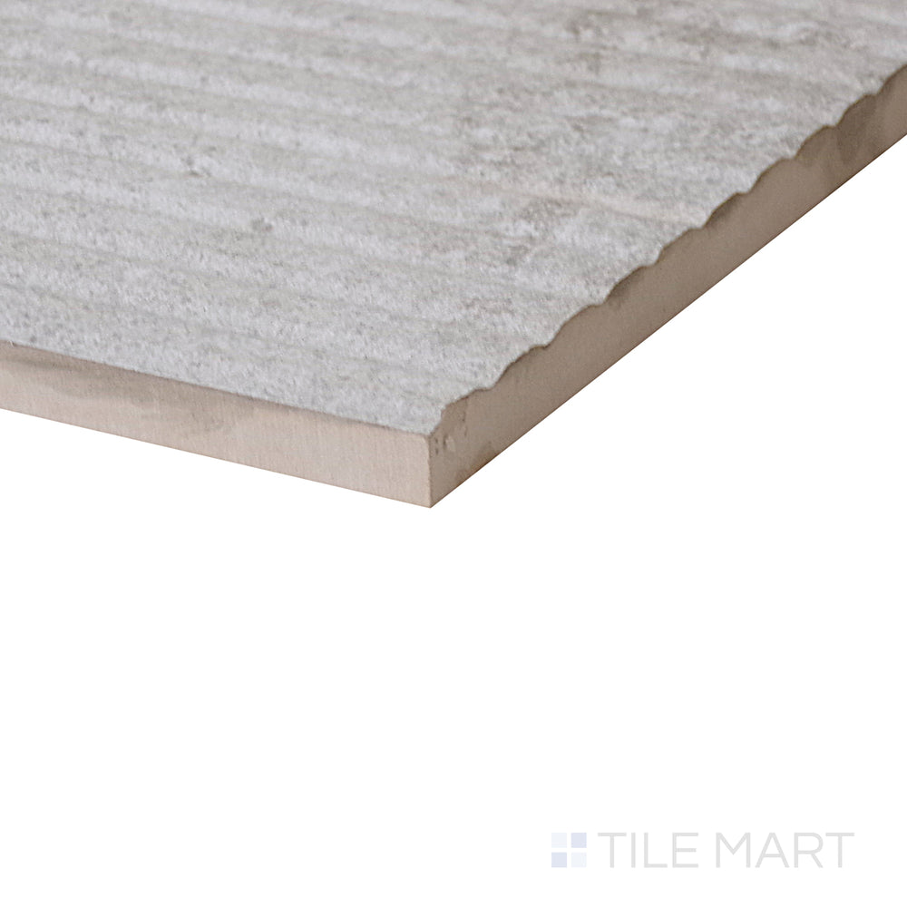 Diagonal view of Dome Bone Deco 12x36 matte porcelain tile, showcasing its stylish decorative pattern, soft matte finish, and structured rectangular layout.  