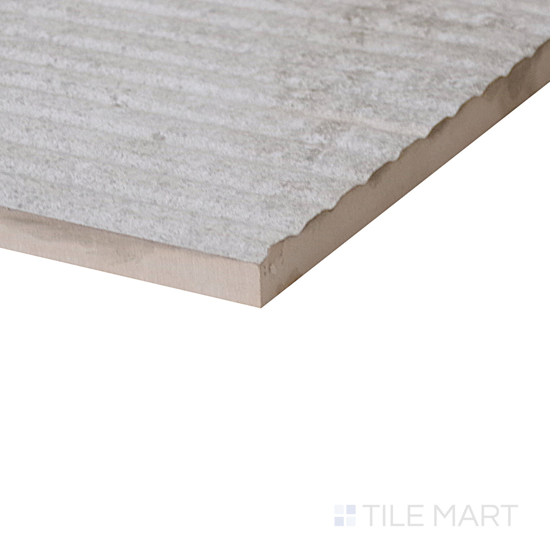 Diagonal view of Dome Bone Deco 12x36 matte porcelain tile, showcasing its stylish decorative pattern, soft matte finish, and structured rectangular layout.  