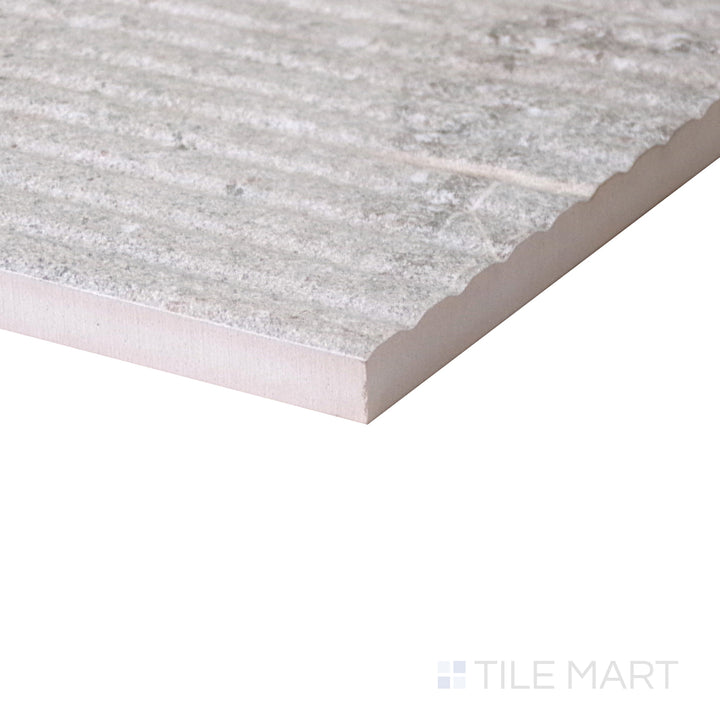 Slanted perspective of Dome Nut Deco 12x36 matte porcelain tile, emphasizing its intricate decorative design, warm nut brown tones, and refined matte surface.  