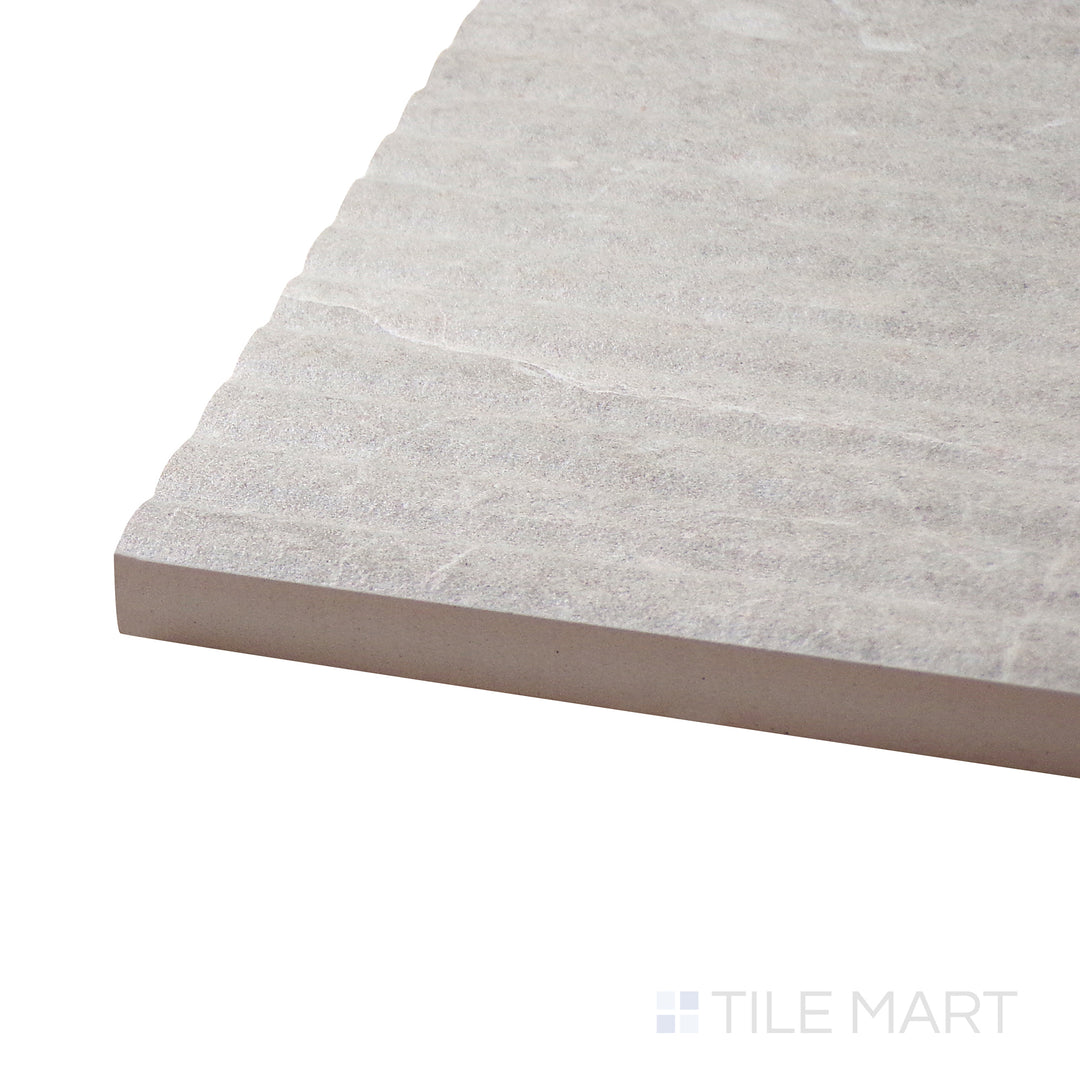 Corner-focused shot of Dome Nut Deco 12X36 Matte Porcelain Tile, highlighting its warm brown tones with an artistic decorative pattern in a