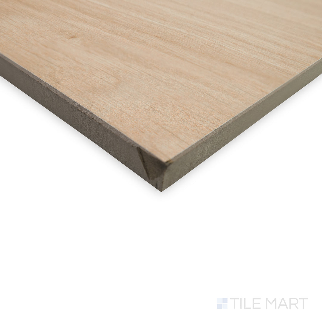 Corner perspective of Dover Sand 10x60 matte porcelain tile, showcasing its elongated shape, warm sandy tones, and sharp, well-defined edges meeting at a seamless angle.