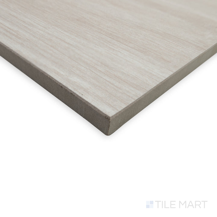 Angled close-up of Dover White 10x60 matte porcelain tile, emphasizing its crisp, neutral shade and the way its finely cut edges create a precise, structured corner.