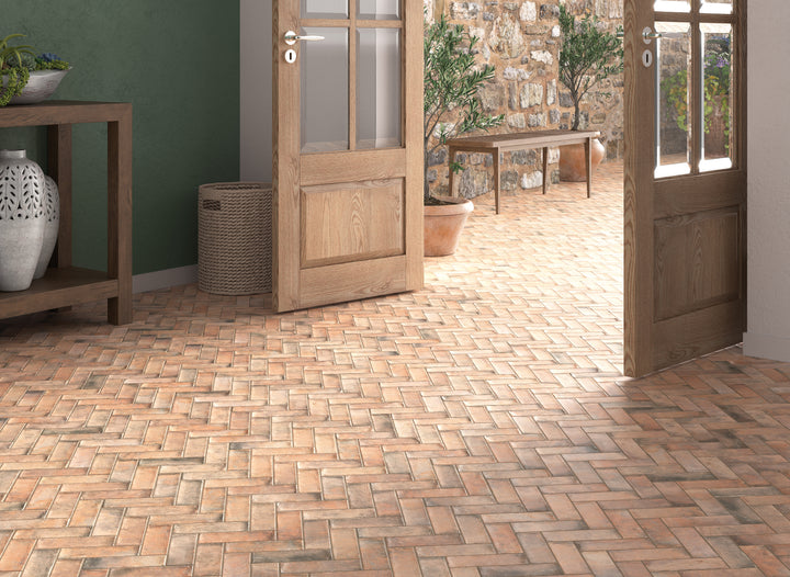 A rustic and inviting space featuring Gandia Cotto 2X6 Matte Porcelain, delivering an earthy, handcrafted look.