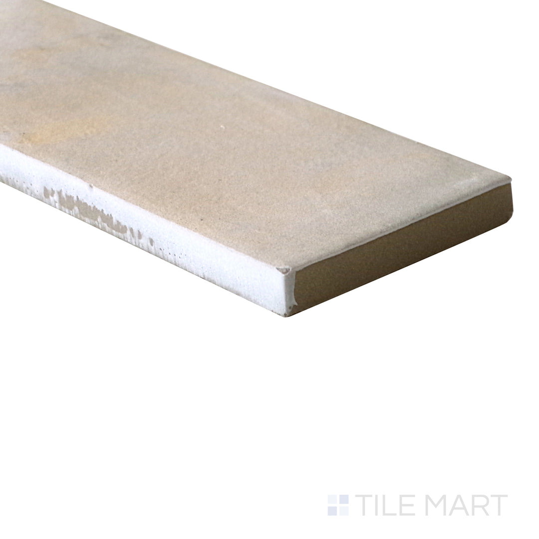 Diagonal view of Gandia Sand 2x6 matte porcelain tile, showcasing its soft sandy tones, refined matte surface, and elongated rectangular format.  