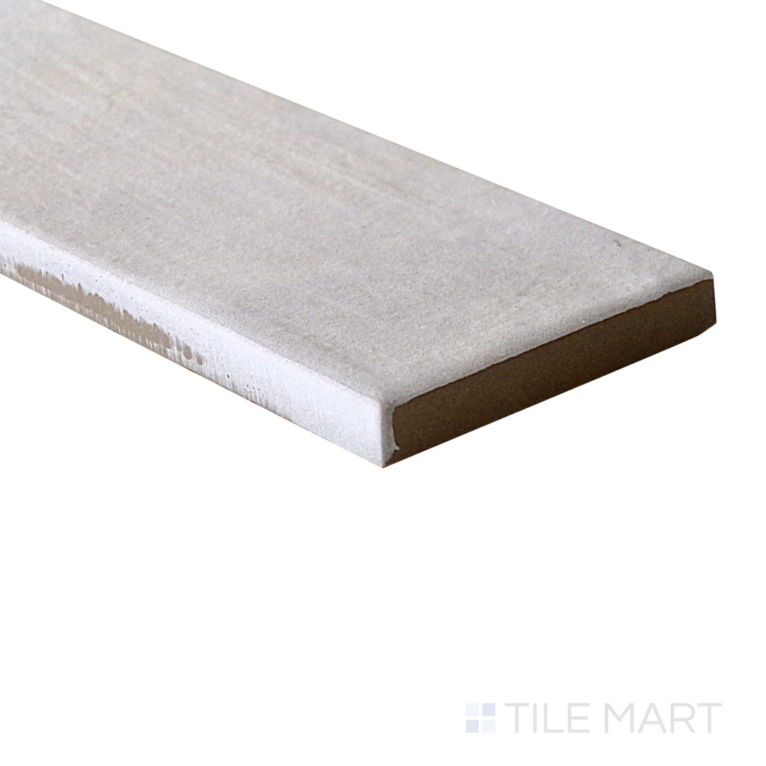 Slanted perspective of Gandia White 2x6 matte porcelain tile, emphasizing its crisp white shade, subtle matte texture, and contemporary rectangular layout.  