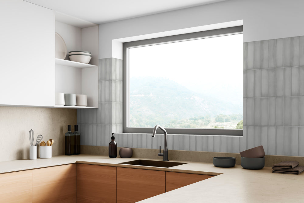 A refined and elegant ambiance created with Ghent Alpine White 3X9 Matte Porcelain, adding subtle texture and brightness.