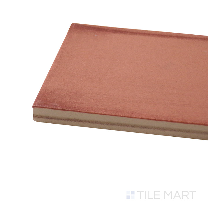 Corner-focused shot of Ghent Copper 3X9 Matte Porcelain Tile, highlighting its rich copper tones with a contemporary matte surface.