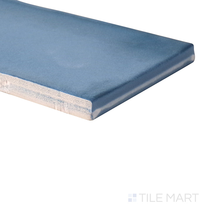 Angled shot of Ghent Steel Blue 3x9 matte porcelain tile, featuring bold steel blue hues, a smooth matte surface, and an elongated rectangular format.  