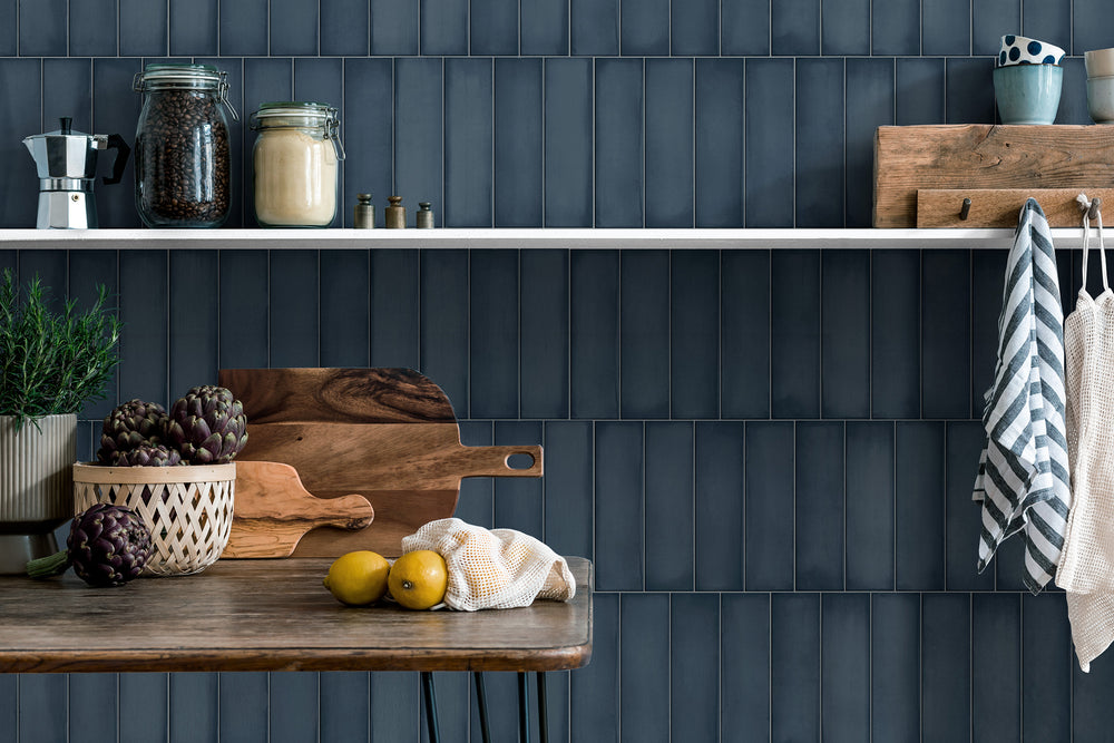 A sleek and modern setting with Ghent Steel Blue 3X9 Matte Porcelain, offering a striking yet calming effect.