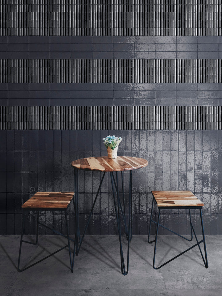 A bold and sophisticated setting with Glace Blu Notte 3X8 Glossy Porcelain, adding deep navy tones with a reflective surface.