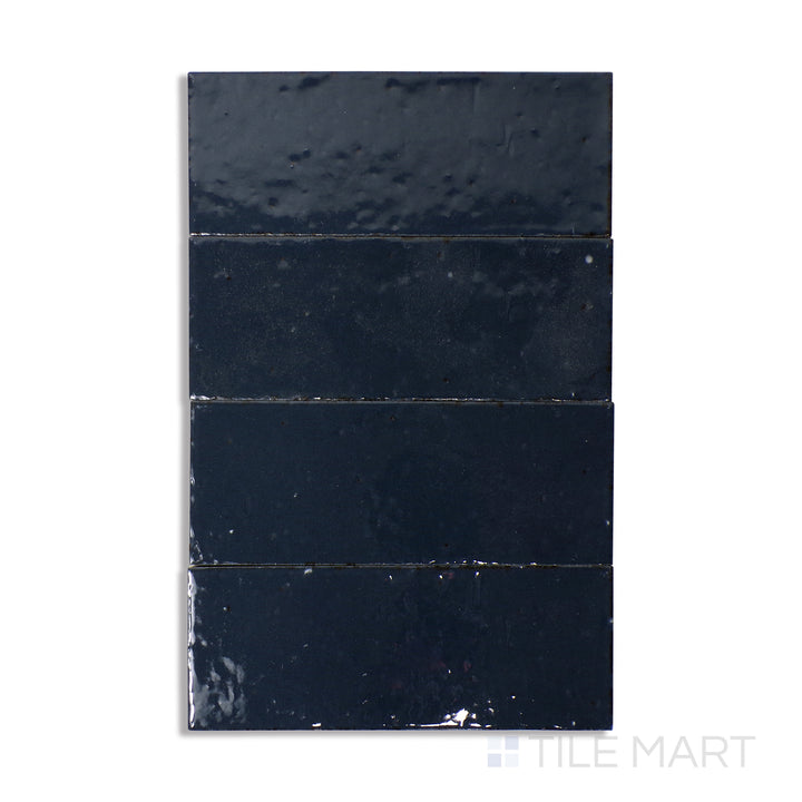 Overhead view of Glace Blu Notte 3X8 Glossy Porcelain, a deep navy-blue tile with a polished glossy sheen, adding richness and luxury.