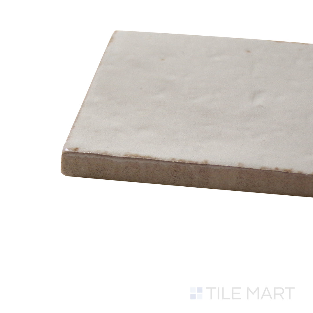 Corner angle of Glace Mastice 3X8 Glossy Porcelain Tile, emphasizing its warm neutral hues with a glossy, smooth texture.