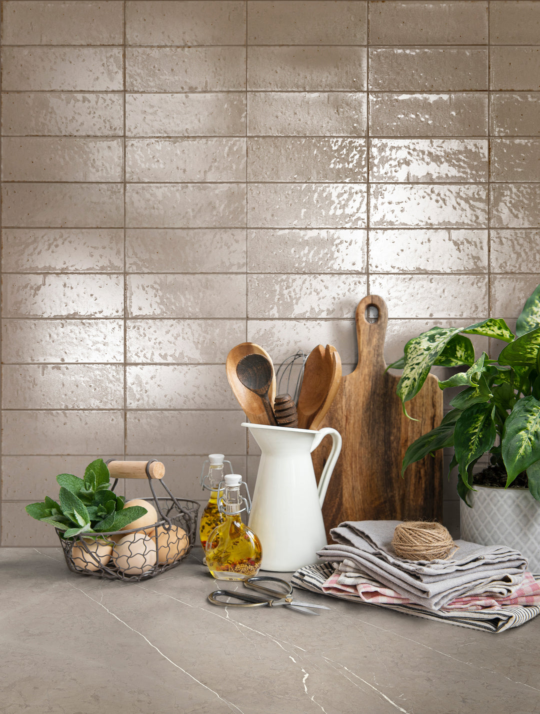 A refined and neutral aesthetic enhanced by Glace Mastice 3X8 Glossy Porcelain, offering soft taupe tones in a sleek, polished design.