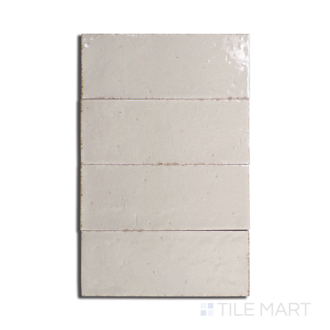 Bird’s-eye perspective of Glace Mastice 3X8 Glossy Porcelain, a soft gray-toned tile with a reflective glossy finish, perfect for a sleek aesthetic.