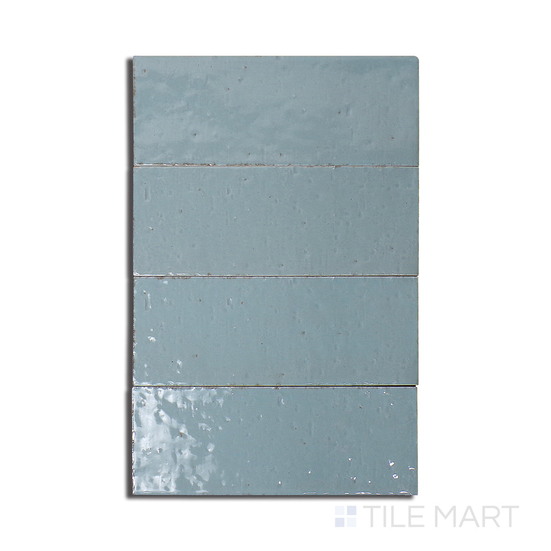 Overhead shot of Glace Turchese 3X8 Glossy Porcelain, a vibrant turquoise tile with a polished gloss, adding a pop of color and brightness.