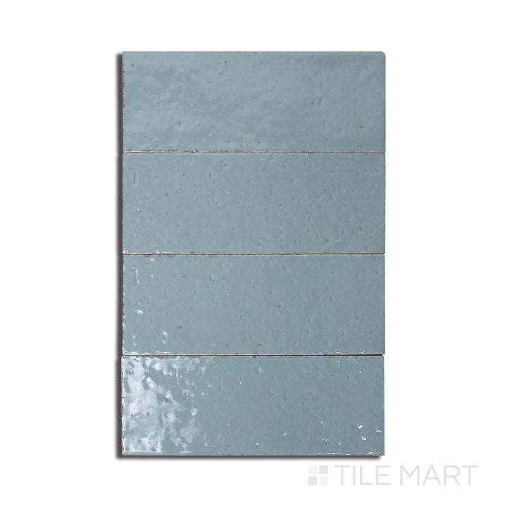 Overhead shot of Glace Turchese 3X8 Glossy Porcelain, a vibrant turquoise tile with a polished gloss, adding a pop of color and brightness.