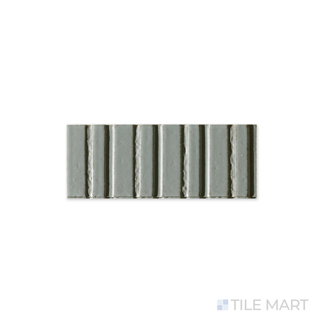 A close-up of Glace Avio 3x8 glossy porcelain tile captures its smooth, reflective surface and rich blue tone, creating a sleek and modern aesthetic.