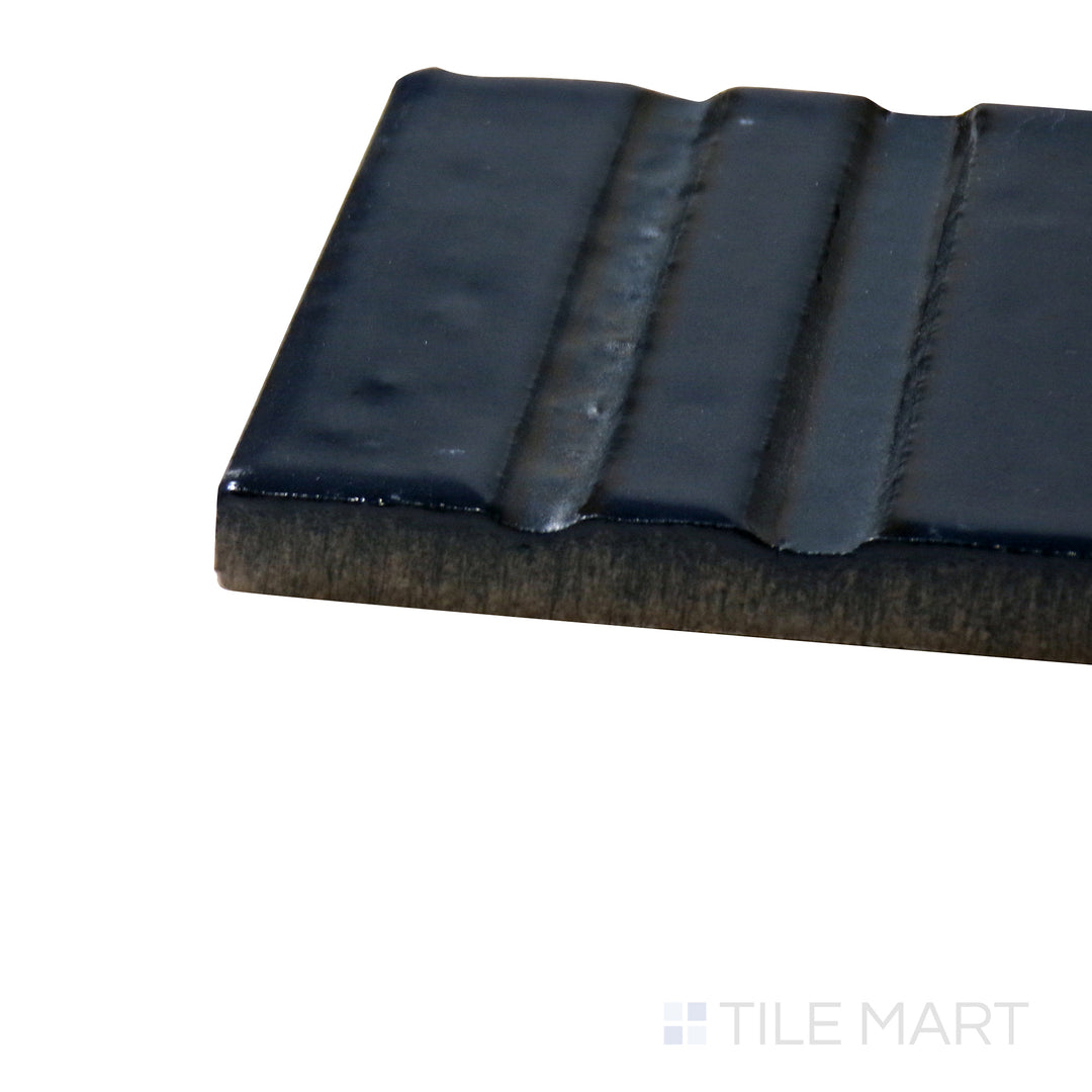 Corner-focused shot of Glace Blu Notte 3X8 Glossy Porcelain Tile, highlighting its bold midnight blue color with a smooth, glass-like finish.