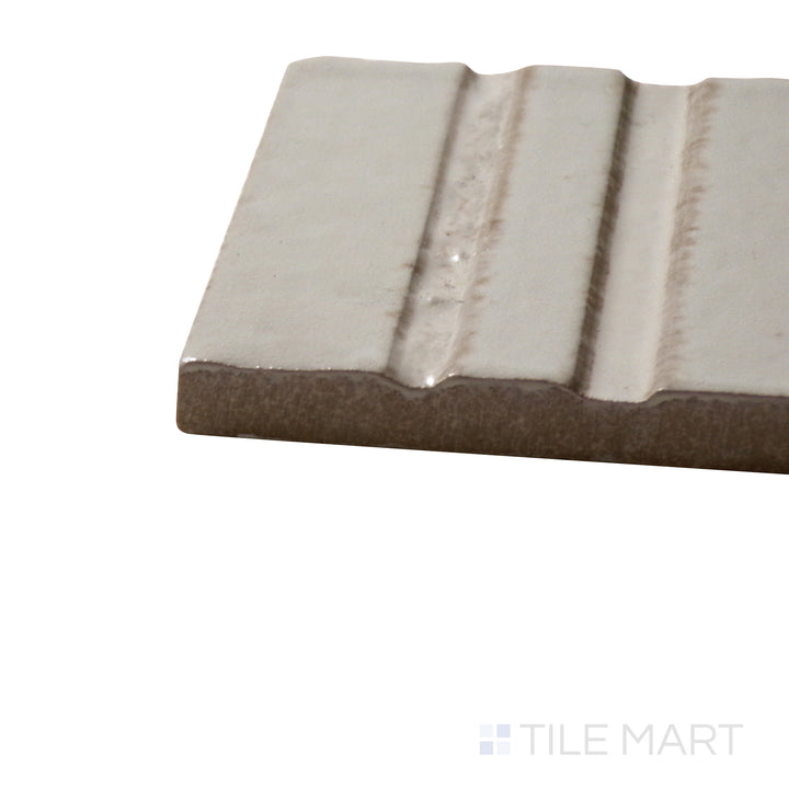 Close-up corner shot of Glace Mastice 3X8 Glossy Porcelain Tile, featuring its soft beige-gray tones with a high-gloss, refined look.