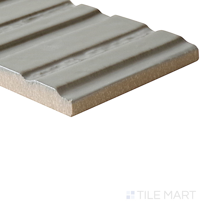 Slanted perspective of Glace Muschio 3x8 glossy porcelain tile, emphasizing its rich green hues, smooth glossy finish, and contemporary rectangular format.  