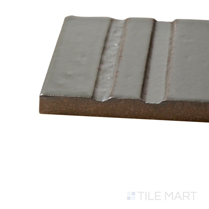 Corner angle of Glace Muschio 3X8 Glossy Porcelain Tile, emphasizing its fresh green shade with a polished, luminous surface.