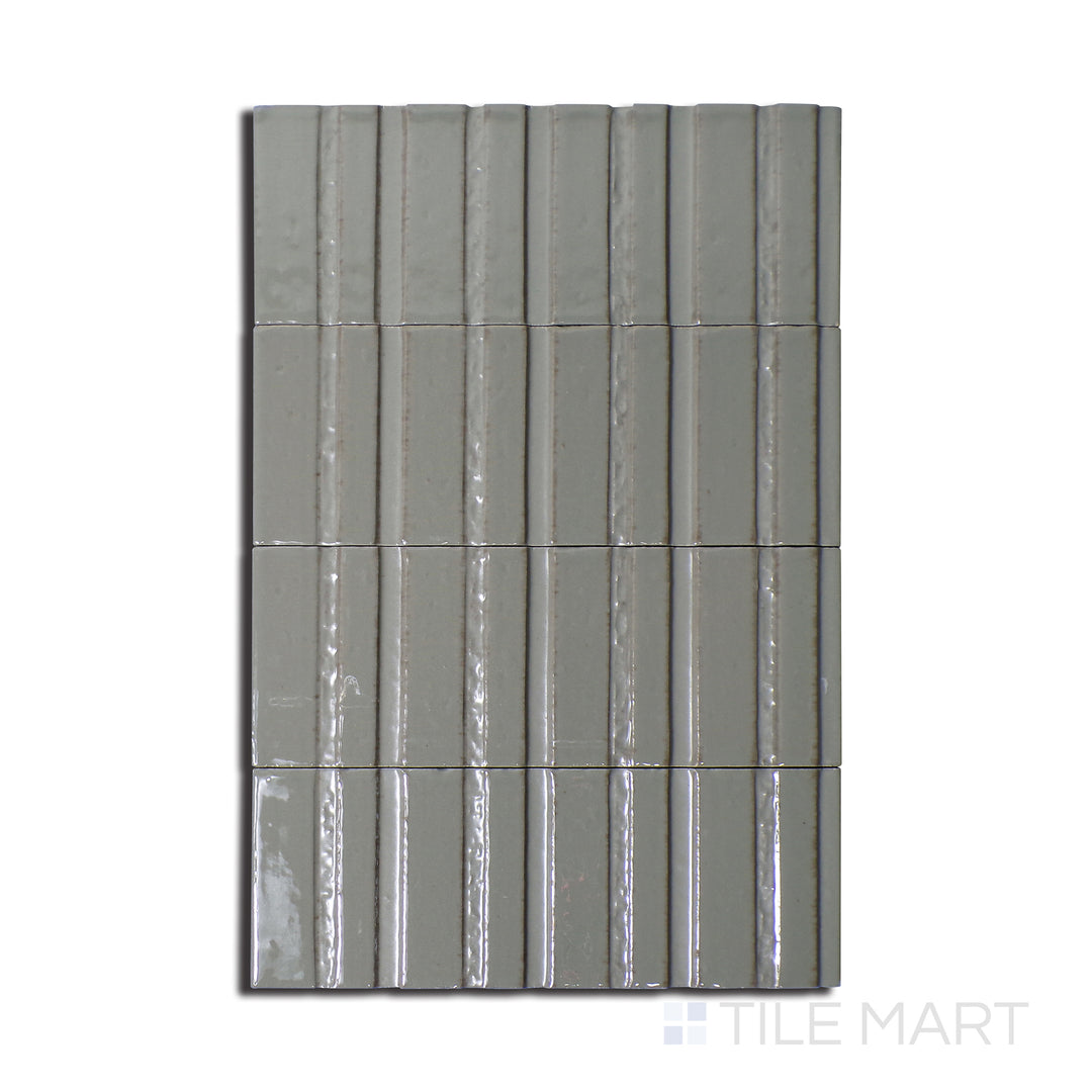 Top-down perspective of Glace Muschio 3X8 Glossy Porcelain, a subtle green tile with a high-shine glossy texture, adding a refreshing feel to spaces.